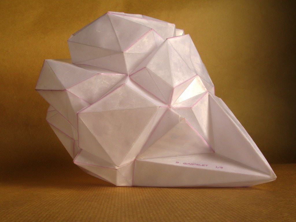 I folded a lot of papers when I stopped being a bronze sculptor. A need to lighten up, no doubt. However, I sometimes convert paper into bronze. In this case, I use wax/lost paper instead of the traditional lost wax. I use thin paper because it deforms and inflections linked to the tensions of folding appear and leave a trace. These stigmata of the action of folding paper tell the story of the formation of volume in the manner of a tree’s bark, which cracks and deforms as it grows.