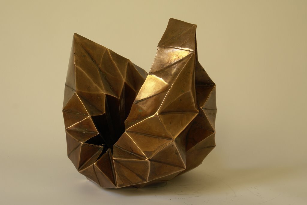 I folded a lot of papers when I stopped being a bronze sculptor. A need to lighten up, no doubt. However, I sometimes convert paper into bronze. In this case, I use wax/lost paper instead of the traditional lost wax. I use thin paper because it deforms and inflections linked to the tensions of folding appear and leave a trace. These stigmata of the action of folding paper tell the story of the formation of volume in the manner of a tree’s bark, which cracks and deforms as it grows.