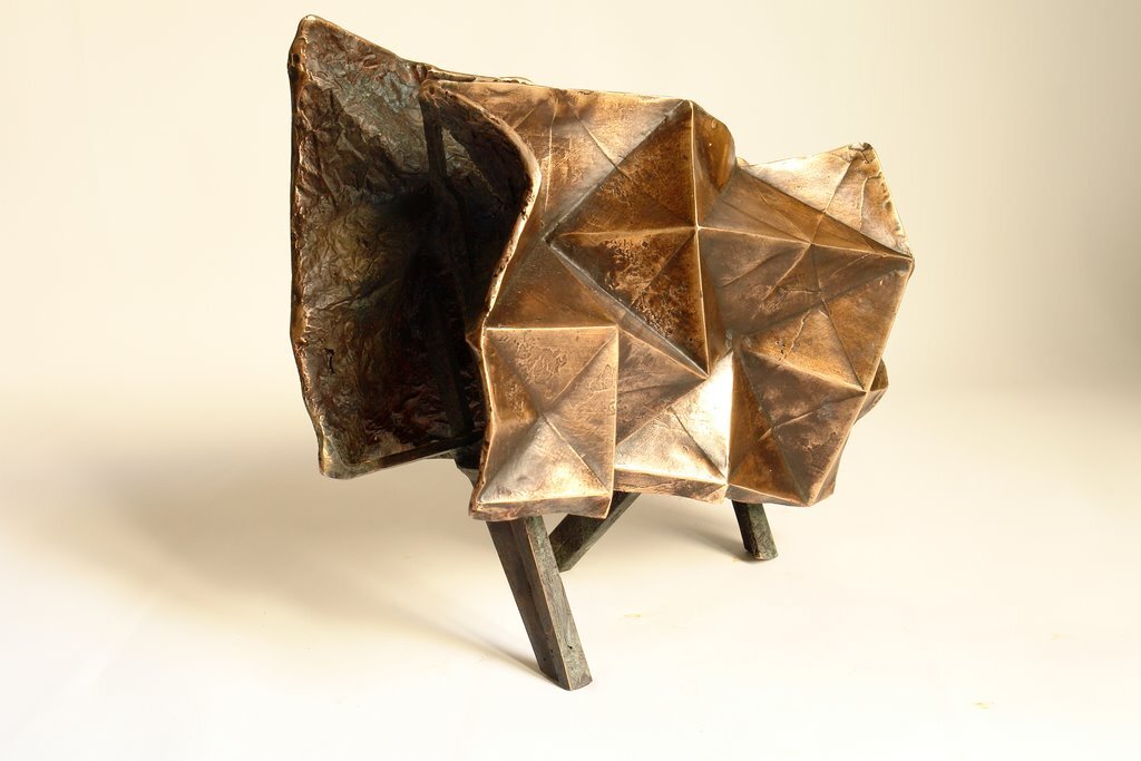 I folded a lot of papers when I stopped being a bronze sculptor. A need to lighten up, no doubt. However, I sometimes convert paper into bronze. In this case, I use wax/lost paper instead of the traditional lost wax. I use thin paper because it deforms and inflections linked to the tensions of folding appear and leave a trace. These stigmata of the action of folding paper tell the story of the formation of volume in the manner of a tree’s bark, which cracks and deforms as it grows.