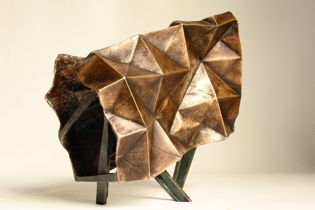 I folded a lot of papers when I stopped being a bronze sculptor. A need to lighten up, no doubt. However, I sometimes convert paper into bronze. In this case, I use wax/lost paper instead of the traditional lost wax. I use thin paper because it deforms and inflections linked to the tensions of folding appear and leave a trace. These stigmata of the action of folding paper tell the story of the formation of volume in the manner of a tree’s bark, which cracks and deforms as it grows.