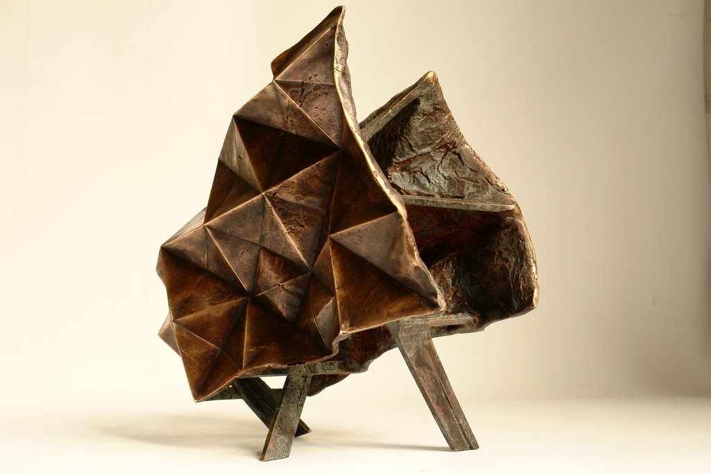 I folded a lot of papers when I stopped being a bronze sculptor. A need to lighten up, no doubt. However, I sometimes convert paper into bronze. In this case, I use wax/lost paper instead of the traditional lost wax. I use thin paper because it deforms and inflections linked to the tensions of folding appear and leave a trace. These stigmata of the action of folding paper tell the story of the formation of volume in the manner of a tree’s bark, which cracks and deforms as it grows.