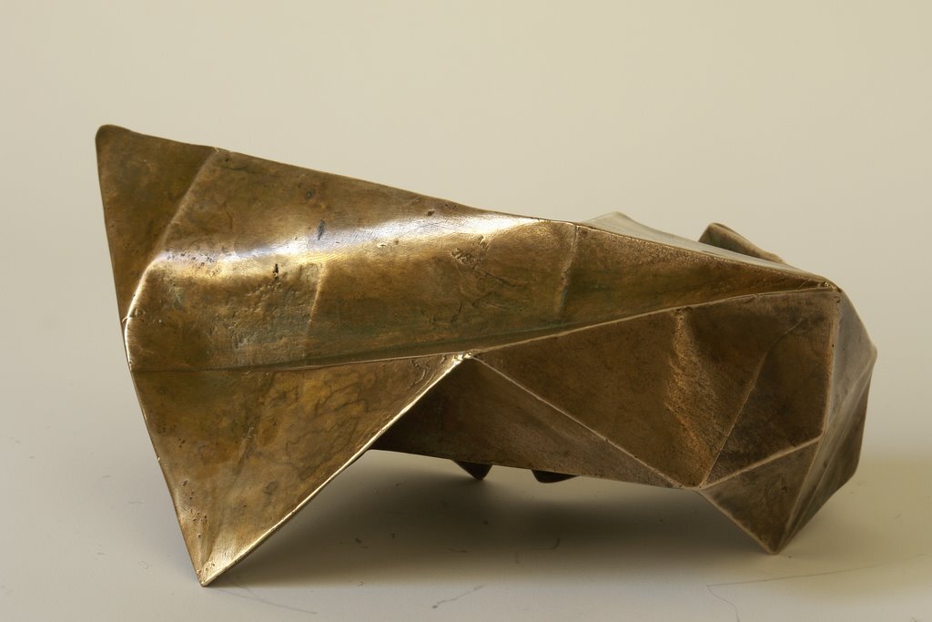 I folded a lot of papers when I stopped being a bronze sculptor. A need to lighten up, no doubt. However, I sometimes convert paper into bronze. In this case, I use wax/lost paper instead of the traditional lost wax. I use thin paper because it deforms and inflections linked to the tensions of folding appear and leave a trace. These stigmata of the action of folding paper tell the story of the formation of volume in the manner of a tree’s bark, which cracks and deforms as it grows.