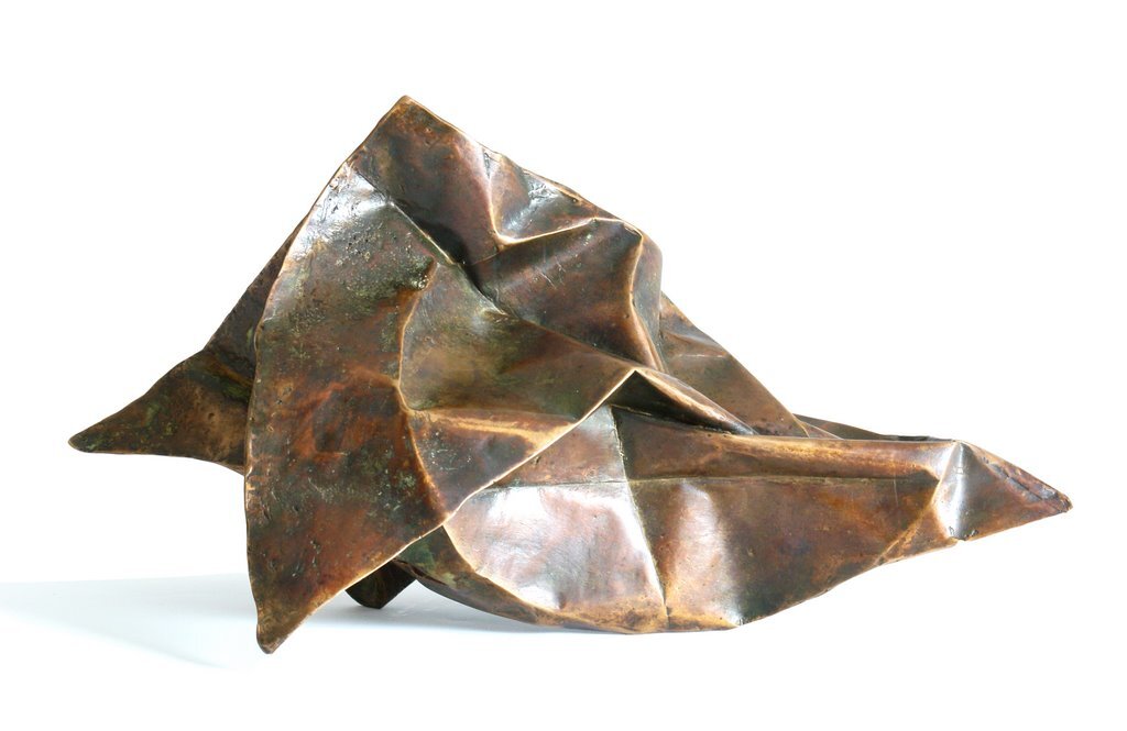I folded a lot of papers when I stopped being a bronze sculptor. A need to lighten up, no doubt. However, I sometimes convert paper into bronze. In this case, I use wax/lost paper instead of the traditional lost wax. I use thin paper because it deforms and inflections linked to the tensions of folding appear and leave a trace. These stigmata of the action of folding paper tell the story of the formation of volume in the manner of a tree’s bark, which cracks and deforms as it grows.