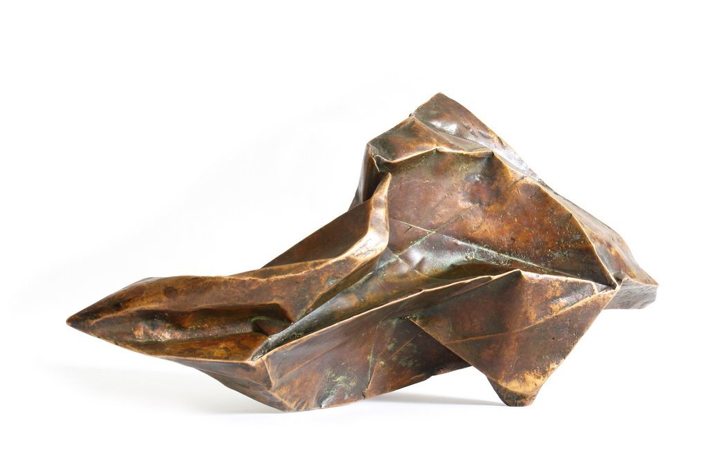 I folded a lot of papers when I stopped being a bronze sculptor. A need to lighten up, no doubt. However, I sometimes convert paper into bronze. In this case, I use wax/lost paper instead of the traditional lost wax. I use thin paper because it deforms and inflections linked to the tensions of folding appear and leave a trace. These stigmata of the action of folding paper tell the story of the formation of volume in the manner of a tree’s bark, which cracks and deforms as it grows.