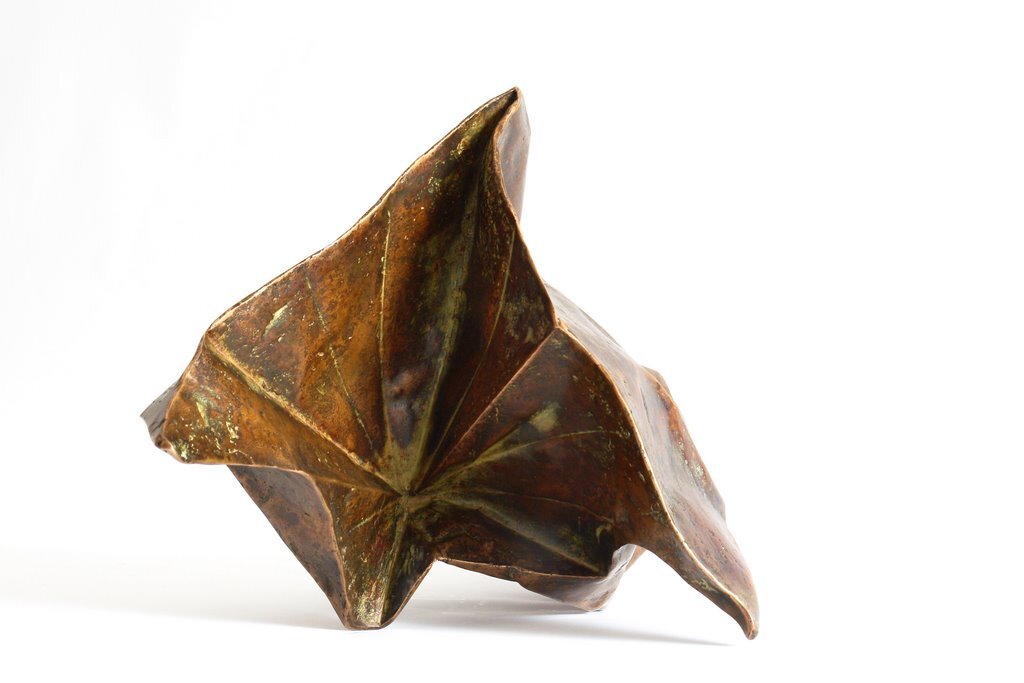 I folded a lot of papers when I stopped being a bronze sculptor. A need to lighten up, no doubt. However, I sometimes convert paper into bronze. In this case, I use wax/lost paper instead of the traditional lost wax. I use thin paper because it deforms and inflections linked to the tensions of folding appear and leave a trace. These stigmata of the action of folding paper tell the story of the formation of volume in the manner of a tree’s bark, which cracks and deforms as it grows.